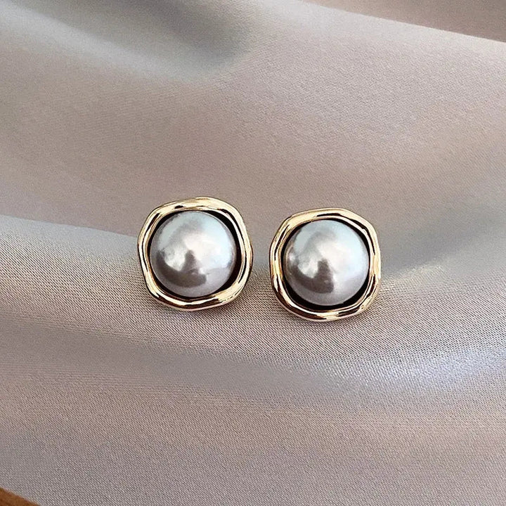 Luxe oorbellen met zwarte parel