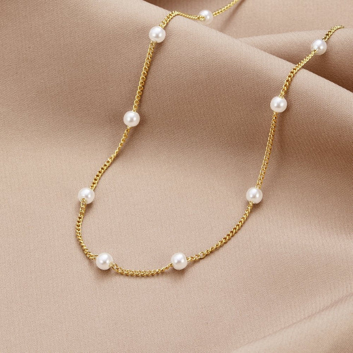Tijdloze ketting met gouden parels